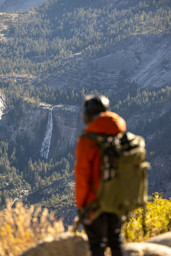 Traveler with backpack exploring Yosemite National Park